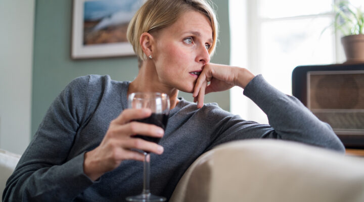 Depressed Woman With Wine Indoors At Home, Mental Health And Alcohol Addiction Concept.