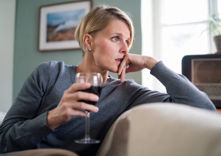 Depressed Woman With Wine Indoors At Home, Mental Health And Alcohol Addiction Concept.